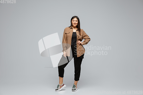 Image of Young caucasian woman in casual wear. Bodypositive female character, plus size businesswoman