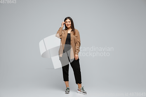 Image of Young caucasian woman in casual wear. Bodypositive female character, plus size businesswoman