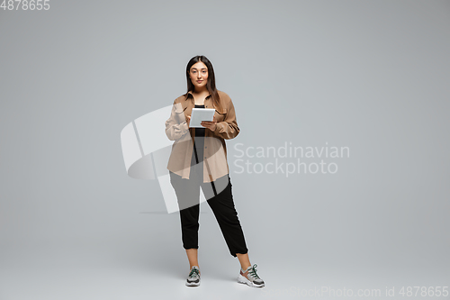 Image of Young caucasian woman in casual wear. Bodypositive female character, plus size businesswoman