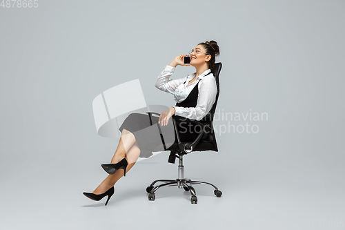 Image of Young caucasian woman in office attire. Bodypositive female character. plus size businesswoman