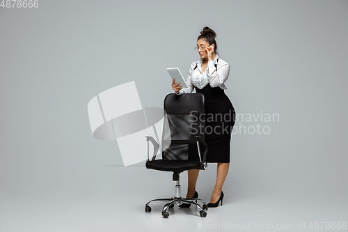 Image of Young caucasian woman in office attire. Bodypositive female character. plus size businesswoman