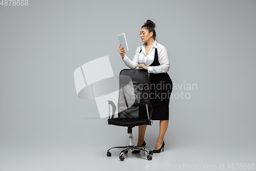 Image of Young caucasian woman in office attire. Bodypositive female character. plus size businesswoman