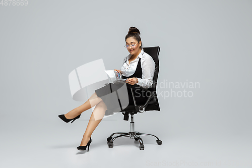 Image of Young caucasian woman in office attire. Bodypositive female character. plus size businesswoman