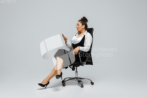 Image of Young caucasian woman in office attire. Bodypositive female character. plus size businesswoman