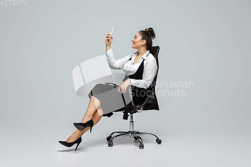 Image of Young caucasian woman in office attire. Bodypositive female character. plus size businesswoman