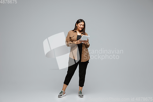 Image of Young caucasian woman in casual wear. Bodypositive female character, plus size businesswoman