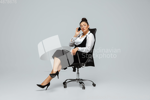 Image of Young caucasian woman in office attire. Bodypositive female character. plus size businesswoman