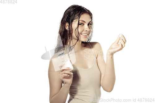 Image of Close up of beautiful young woman over white background. Cosmetics and makeup, natural and eco treatment, skin care.