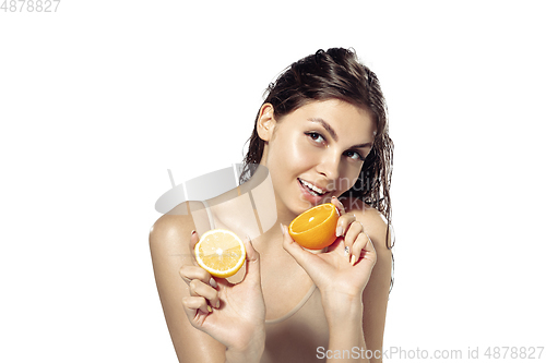 Image of Close up of beautiful young woman over white background. Cosmetics and makeup, natural and eco treatment, skin care.