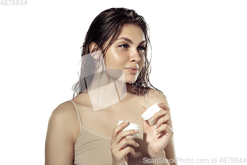 Image of Close up of beautiful young woman over white background. Cosmetics and makeup, natural and eco treatment, skin care.