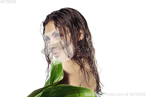 Image of Close up of beautiful young woman over white background. Cosmetics and makeup, natural and eco treatment, skin care.