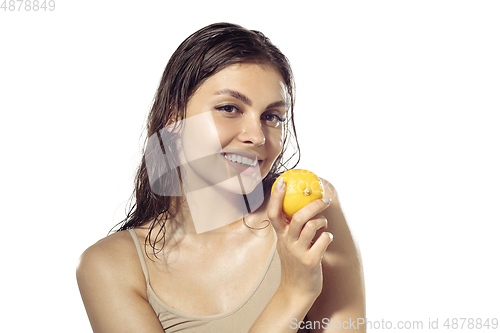 Image of Close up of beautiful young woman over white background. Cosmetics and makeup, natural and eco treatment, skin care.