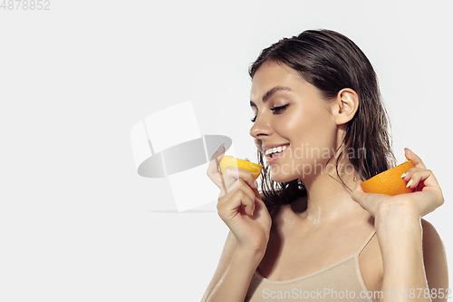 Image of Close up of beautiful young woman over white background. Cosmetics and makeup, natural and eco treatment, skin care.