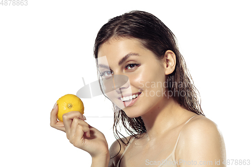 Image of Close up of beautiful young woman over white background. Cosmetics and makeup, natural and eco treatment, skin care.