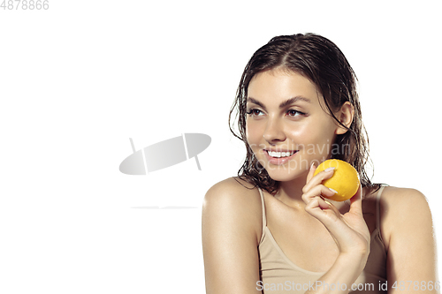 Image of Close up of beautiful young woman over white background. Cosmetics and makeup, natural and eco treatment, skin care.