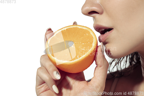 Image of Close up of beautiful young woman over white background. Cosmetics and makeup, natural and eco treatment, skin care.