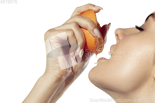 Image of Close up of beautiful young woman over white background. Cosmetics and makeup, natural and eco treatment, skin care.