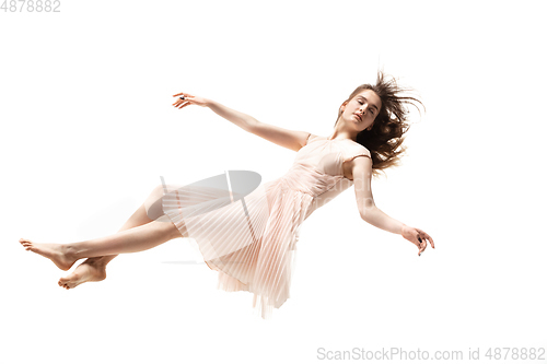 Image of Mid-air beauty. Full length studio shot of attractive young woman hovering in air and keeping eyes closed