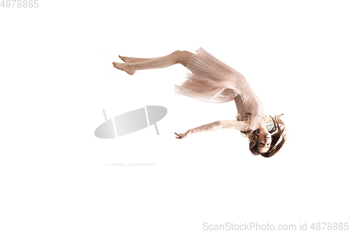 Image of Mid-air beauty. Full length studio shot of attractive young woman hovering in air and keeping eyes closed