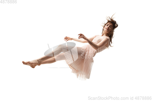 Image of Mid-air beauty. Full length studio shot of attractive young woman hovering in air and keeping eyes closed