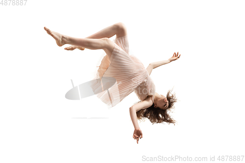 Image of Mid-air beauty. Full length studio shot of attractive young woman hovering in air and keeping eyes closed