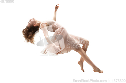 Image of Mid-air beauty. Full length studio shot of attractive young woman hovering in air and keeping eyes closed