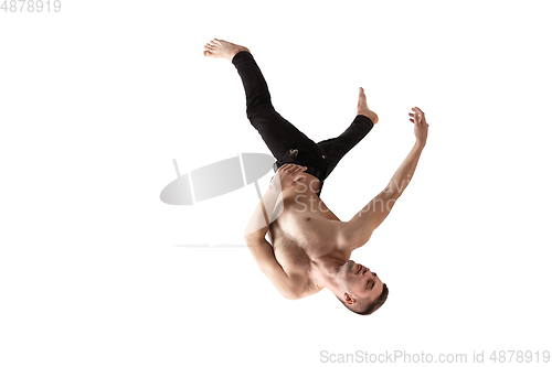 Image of Mid-air beauty. Full length studio shot of attractive young man hovering in air and keeping eyes closed