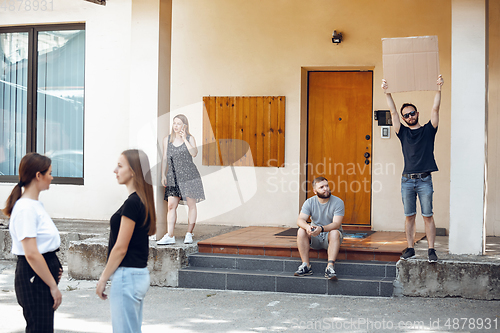 Image of Dude with sign - man stands protesting things that annoy him