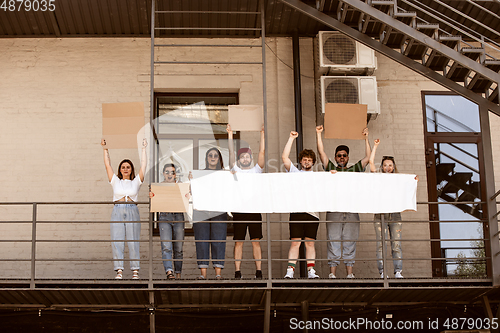 Image of Diverse group of people protesting with blank signs. Protest against human rights, abuse of freedom, social issues