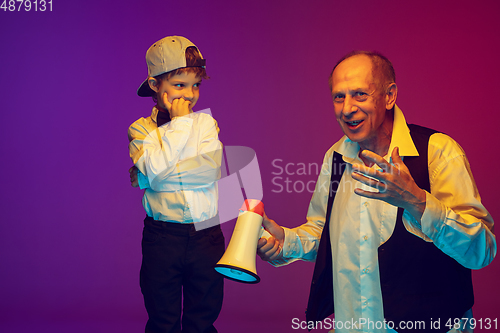Image of Senior man having fun and spending time together with boy, grandson. Joyful elderly lifestyle concept