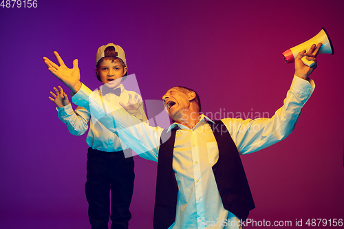 Image of Senior man having fun and spending time together with boy, grandson. Joyful elderly lifestyle concept