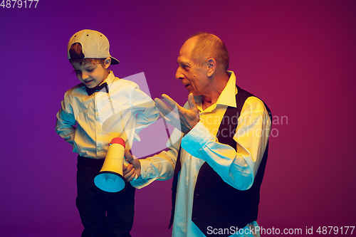 Image of Senior man having fun and spending time together with boy, grandson. Joyful elderly lifestyle concept