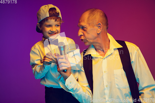 Image of Senior man having fun and spending time together with boy, grandson. Joyful elderly lifestyle concept