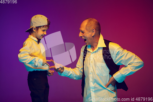 Image of Senior man having fun and spending time together with boy, grandson. Joyful elderly lifestyle concept