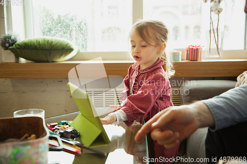 Image of Grandfather and child playing together at home. Happiness, family, relathionship, education concept.