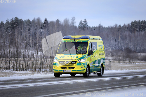 Image of Ambulance on Road in Winter