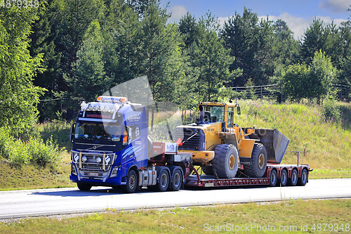 Image of Volvo FH16 Truck Hauls Volvo Wheel Loader on Semi Trailer