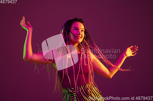 Image of Portrait of young caucasian woman on pink background with copyspace, unusual and freaky appearance