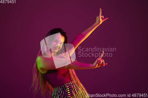 Image of Portrait of young caucasian woman on pink background with copyspace, unusual and freaky appearance