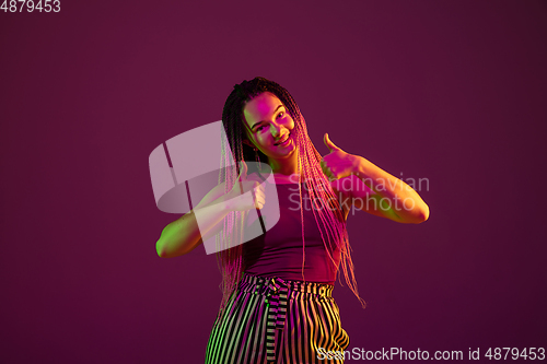 Image of Portrait of young caucasian woman on pink background with copyspace, unusual and freaky appearance