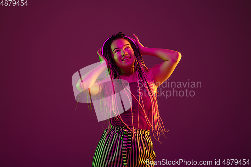 Image of Portrait of young caucasian woman on pink background with copyspace, unusual and freaky appearance