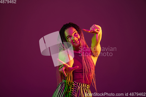 Image of Portrait of young caucasian woman on pink background with copyspace, unusual and freaky appearance