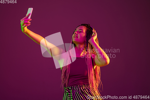 Image of Portrait of young caucasian woman on pink background with copyspace, unusual and freaky appearance