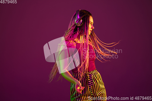 Image of Portrait of young caucasian woman on pink background with copyspace, unusual and freaky appearance