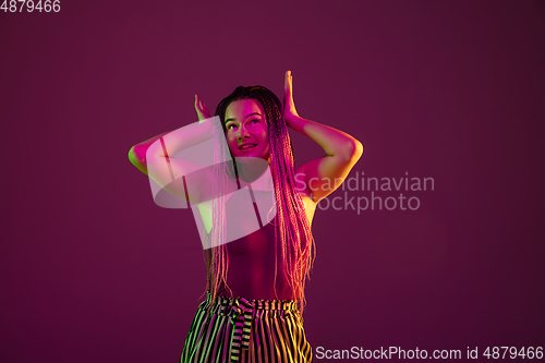 Image of Portrait of young caucasian woman on pink background with copyspace, unusual and freaky appearance