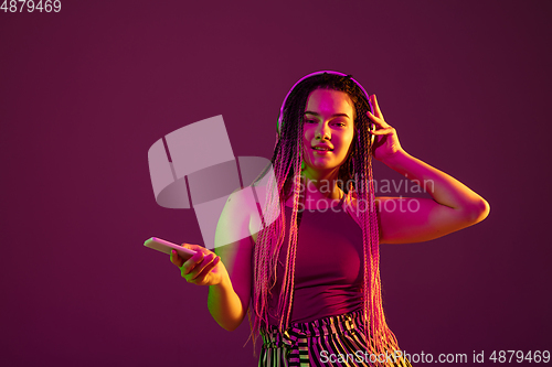 Image of Portrait of young caucasian woman on pink background with copyspace, unusual and freaky appearance