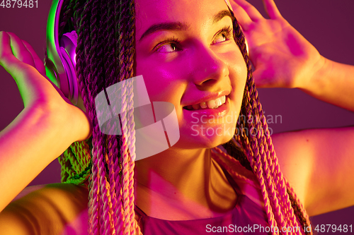 Image of Portrait of young caucasian woman on pink background with copyspace, unusual and freaky appearance