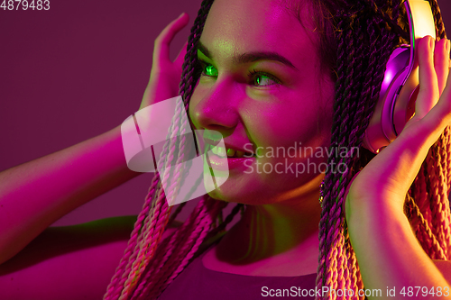 Image of Portrait of young caucasian woman on pink background with copyspace, unusual and freaky appearance