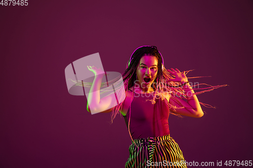 Image of Portrait of young caucasian woman on pink background with copyspace, unusual and freaky appearance