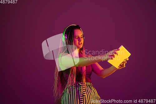 Image of Portrait of young caucasian woman on pink background with copyspace, unusual and freaky appearance